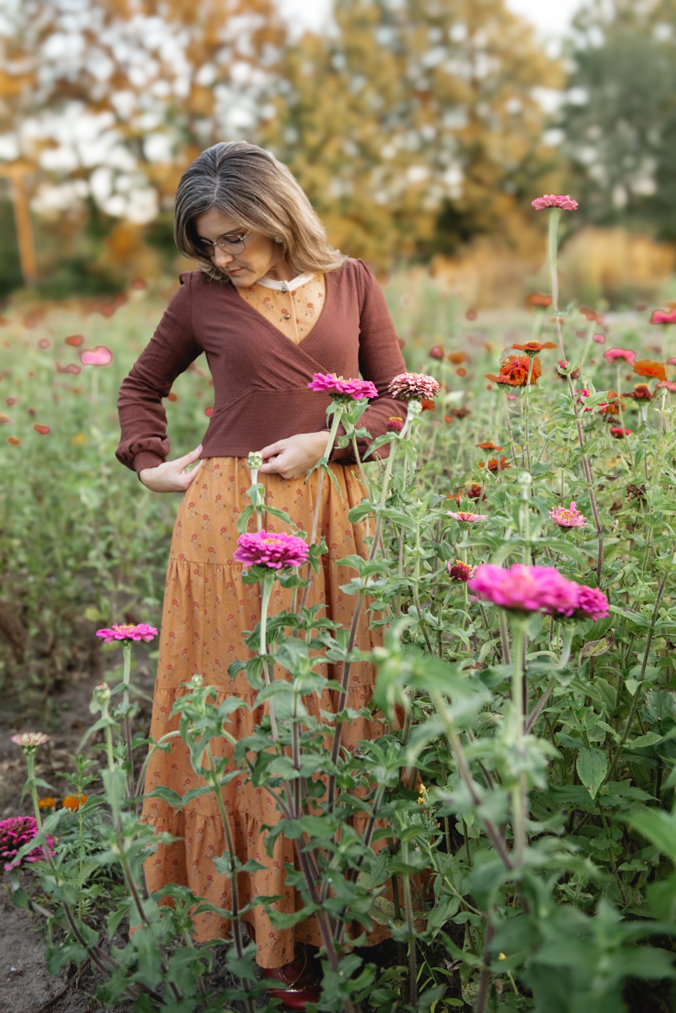 Woman in modest nursing dress flower field