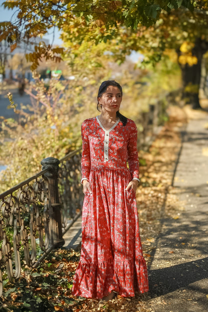 Woman in modest nursing red dress with foliage