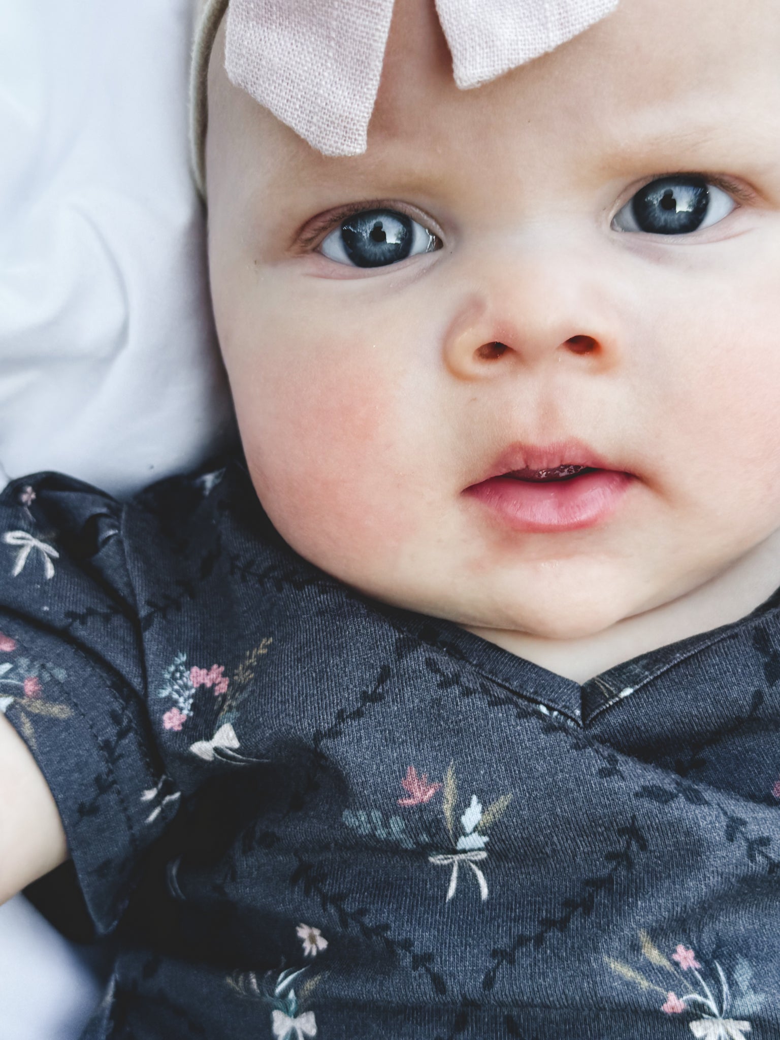 Modest baby closeup dark floral dress headband