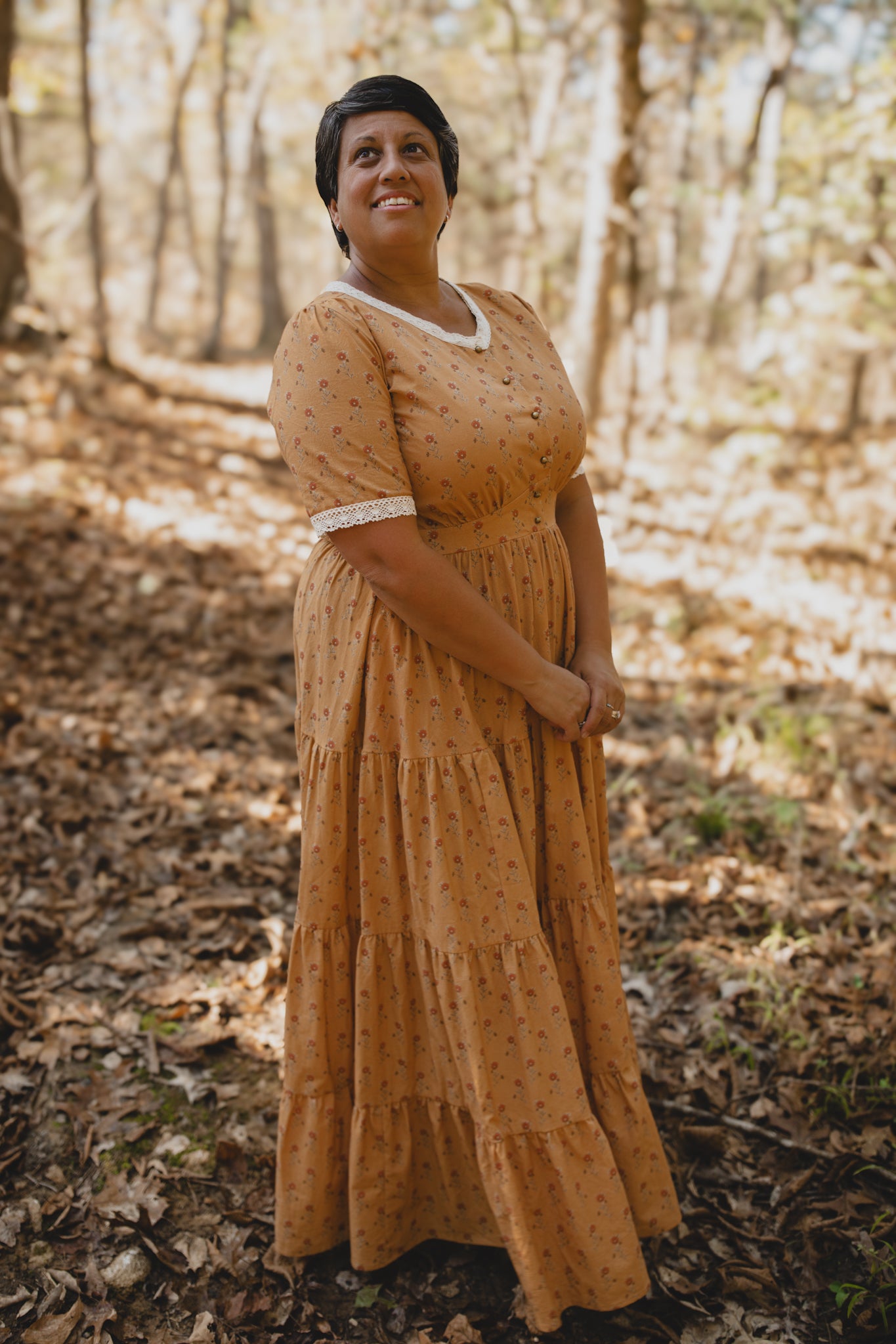 Woman in modest nursing dress in forest