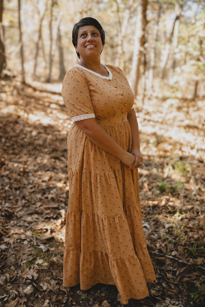 Woman in modest nursing dress in forest