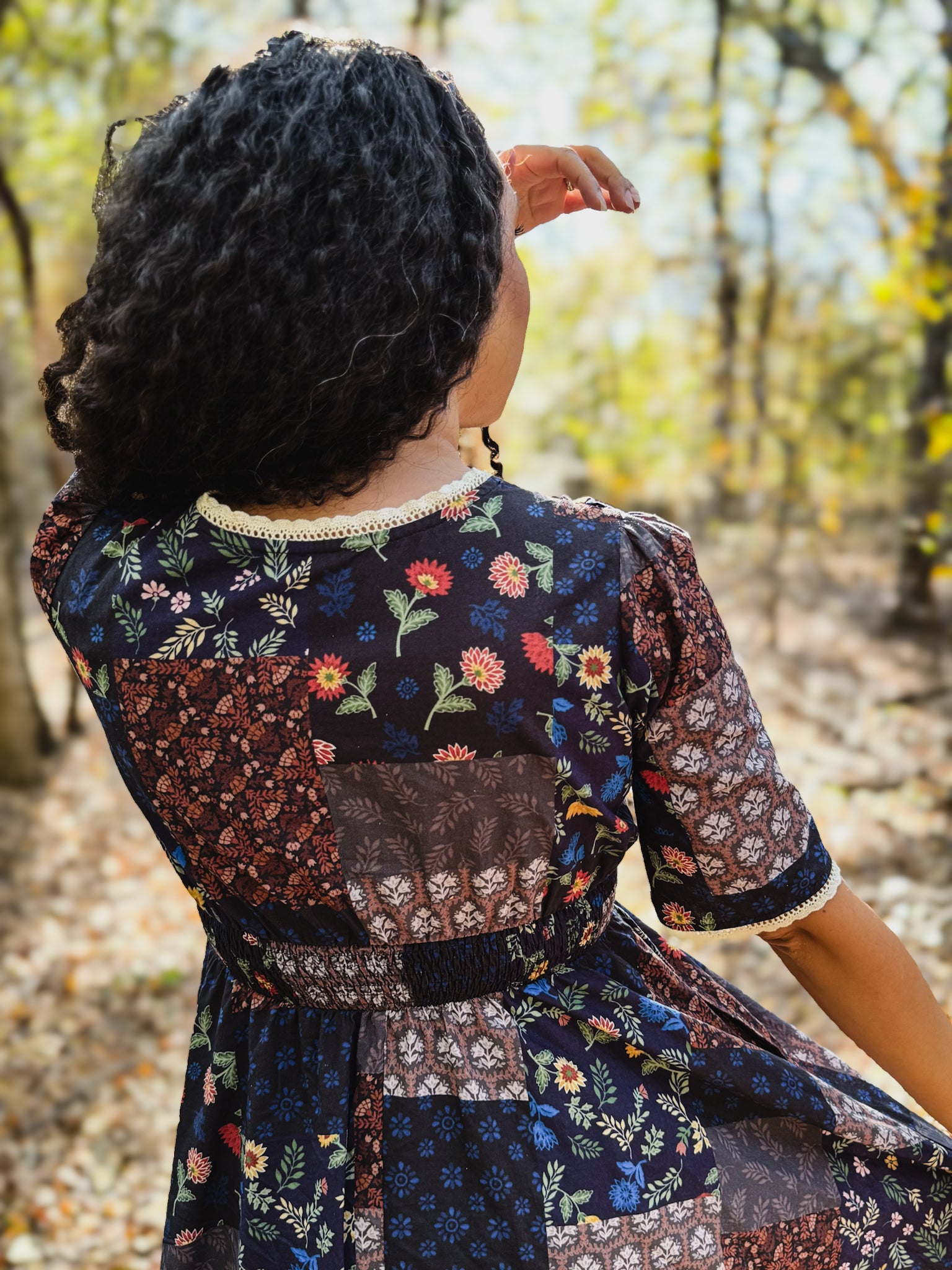 woman wearing a modest nursing patterned dress
