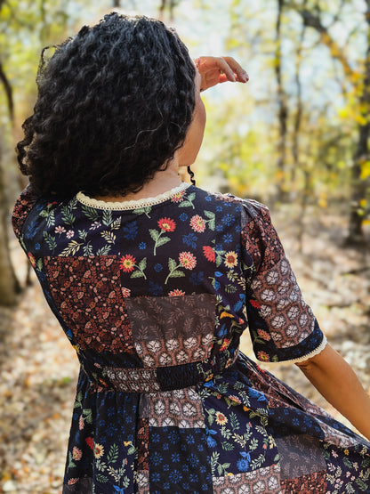 woman wearing a modest nursing patterned dress