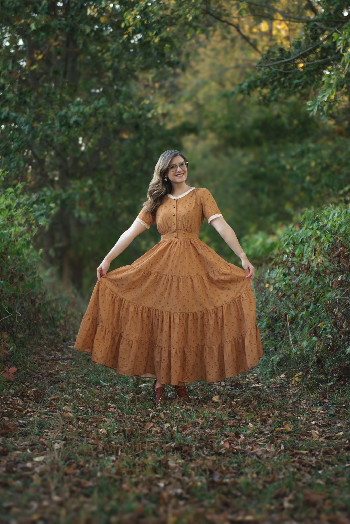 Woman in modest nursing dress standing in forest