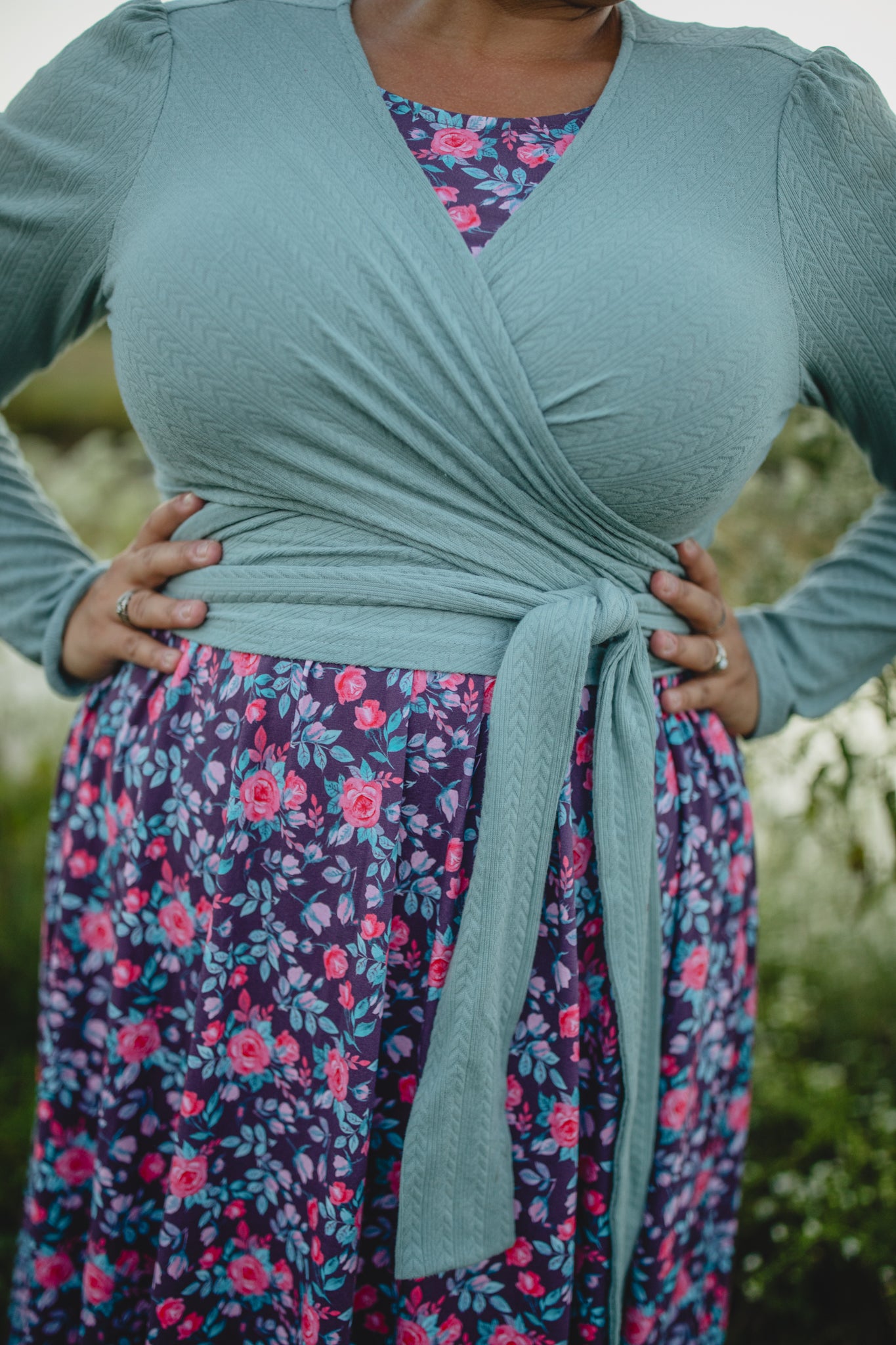 Woman in modest nursing wrap and floral skirt