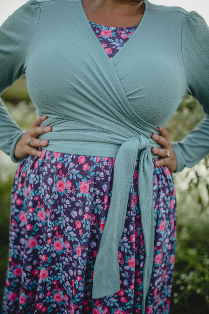 Woman in modest nursing wrap and floral skirt