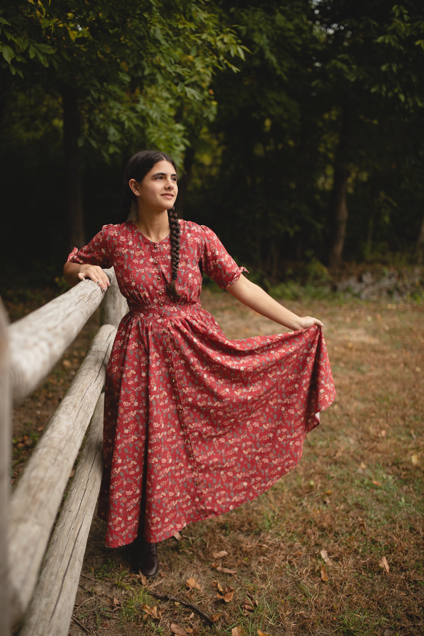Woman in modest nursing red floral dress outdoors