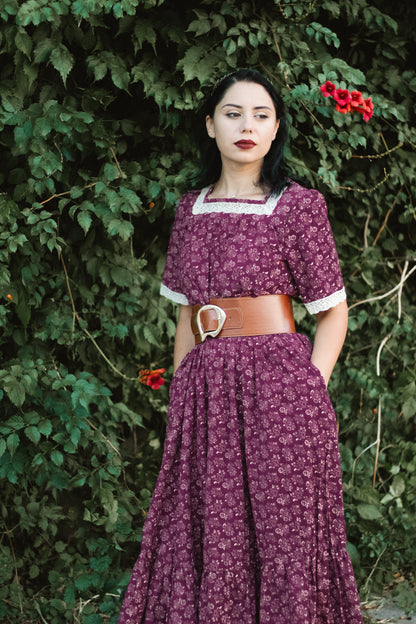 Woman in modest purple floral nursing dress outdoors