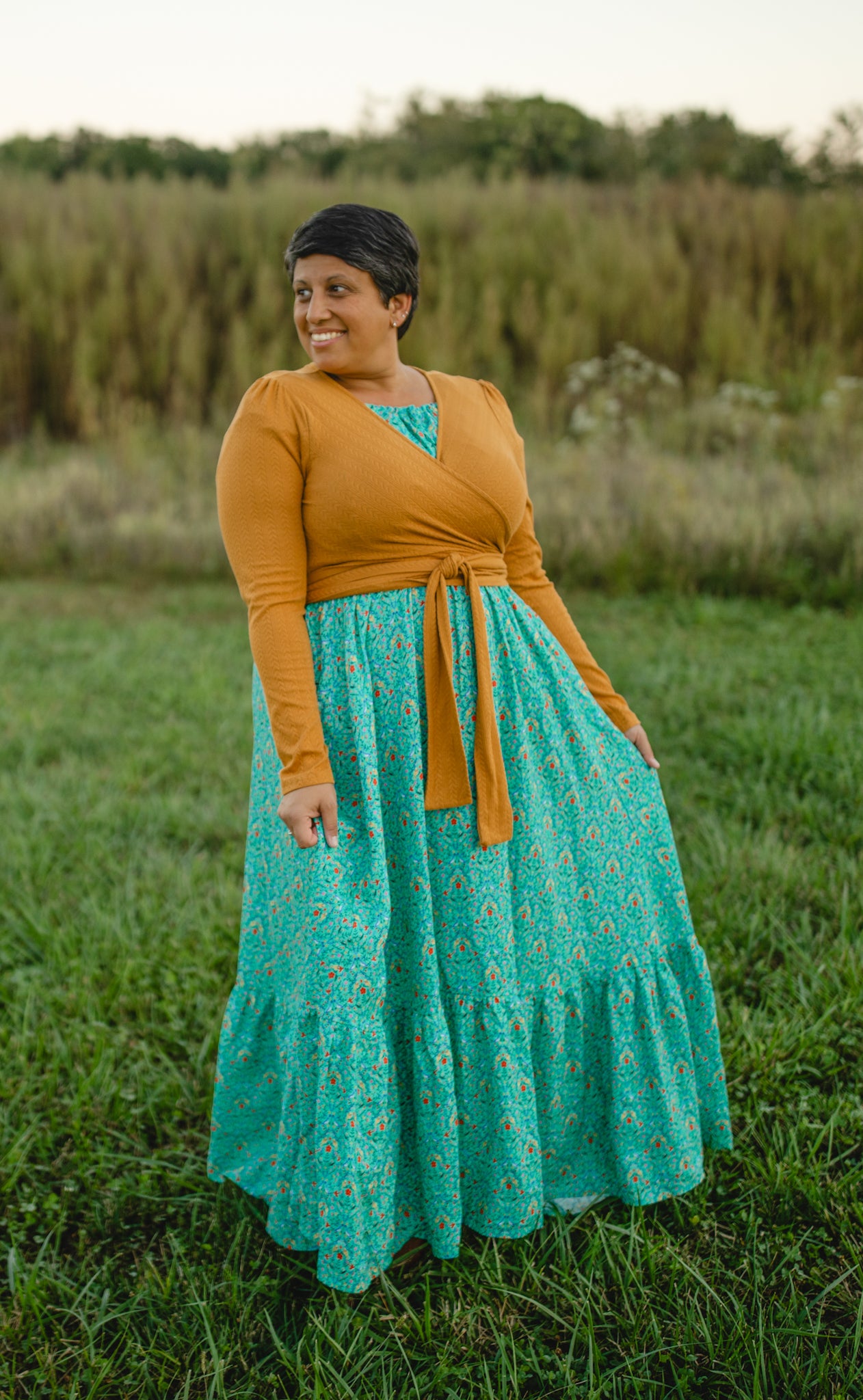 Woman in modest nursing teal dress outdoors