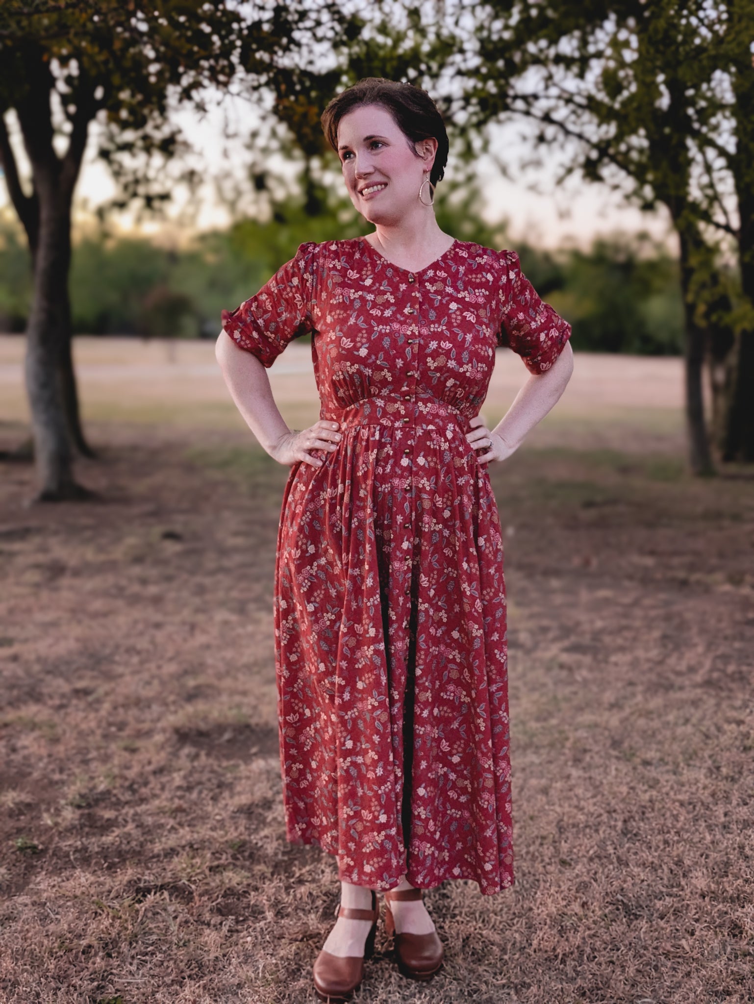 Woman in modest nursing red floral dress outdoors