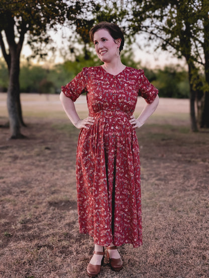 Woman in modest nursing red floral dress outdoors