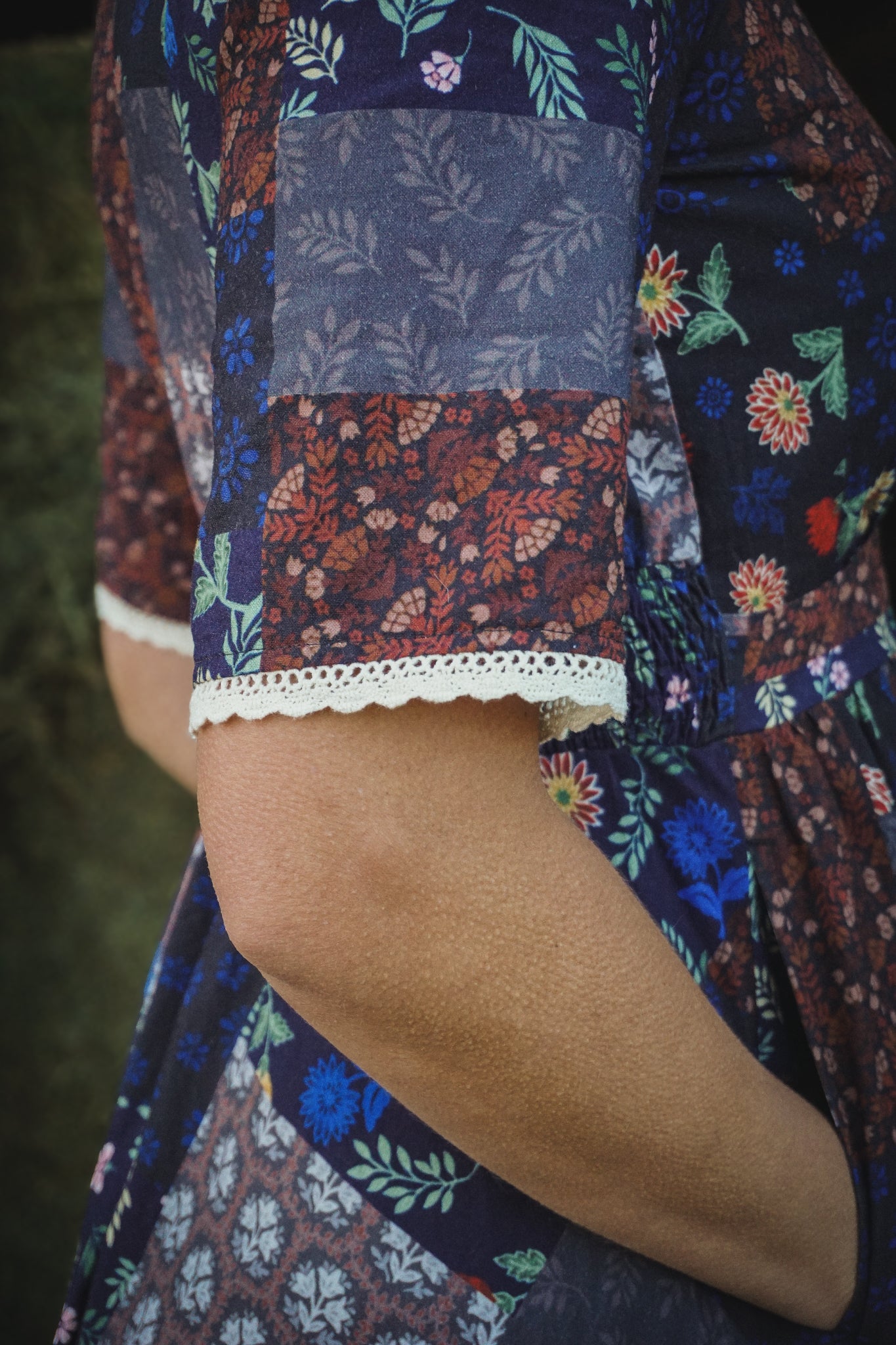 woman wearing a modest nursing patterned dress