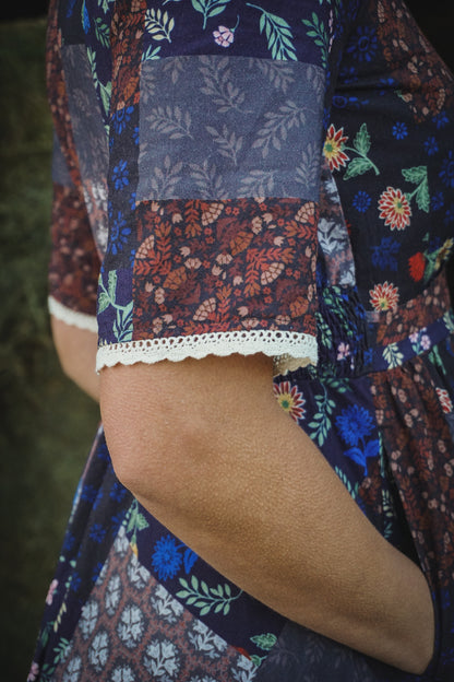woman wearing a modest nursing patterned dress