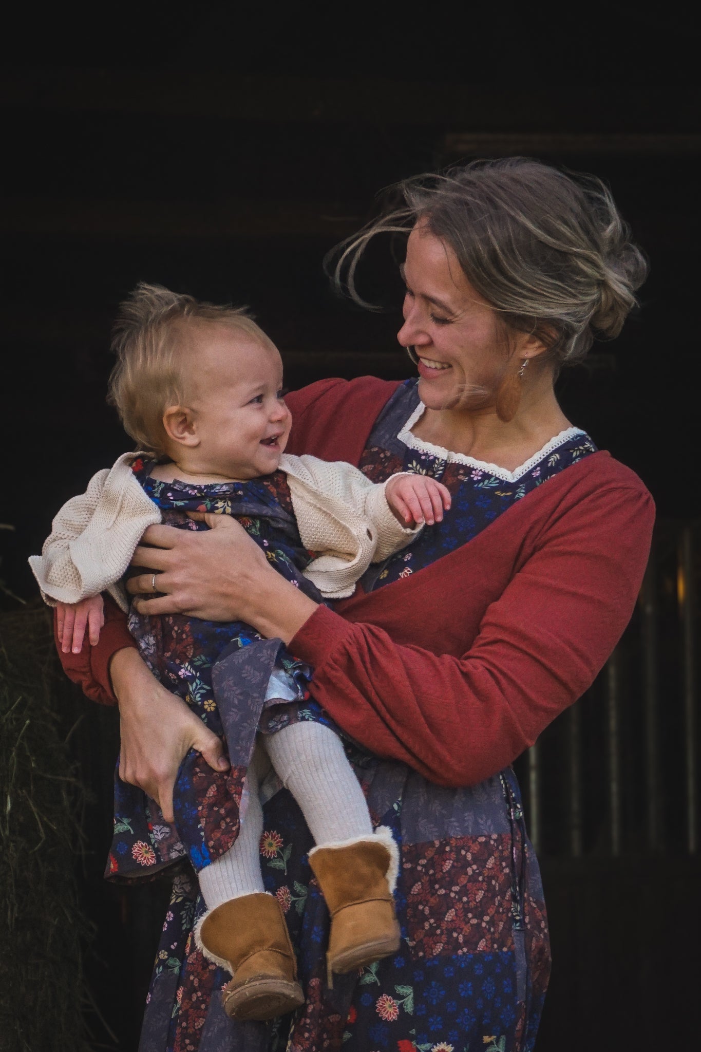 mother wearing a modest nursing patchwork dress with her daughter