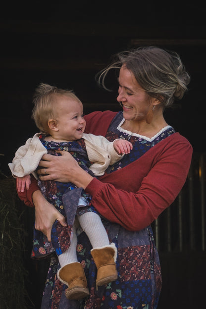 mother wearing a modest nursing patchwork dress with her daughter