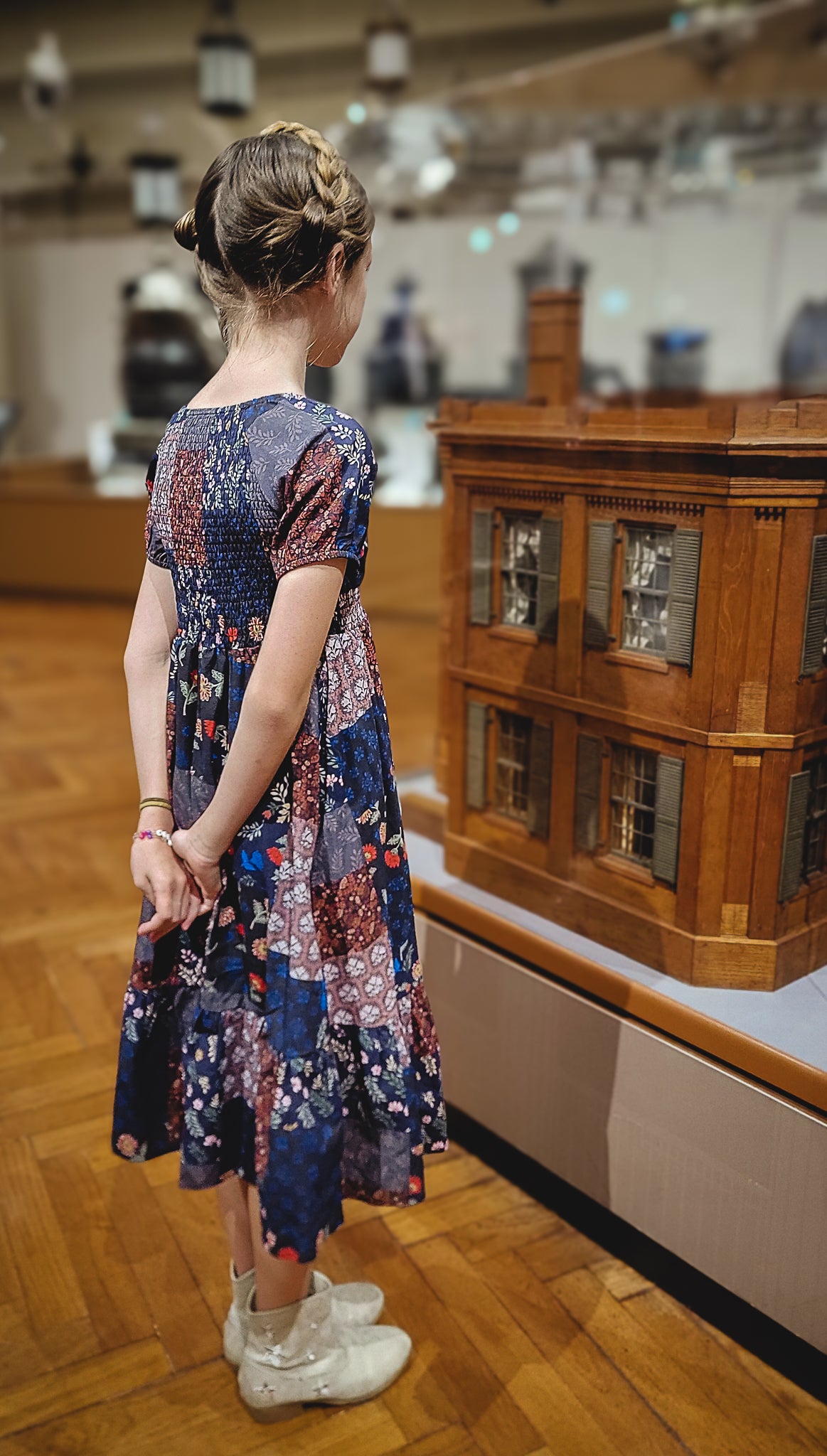 young girl wearing a cute patchwork dress
