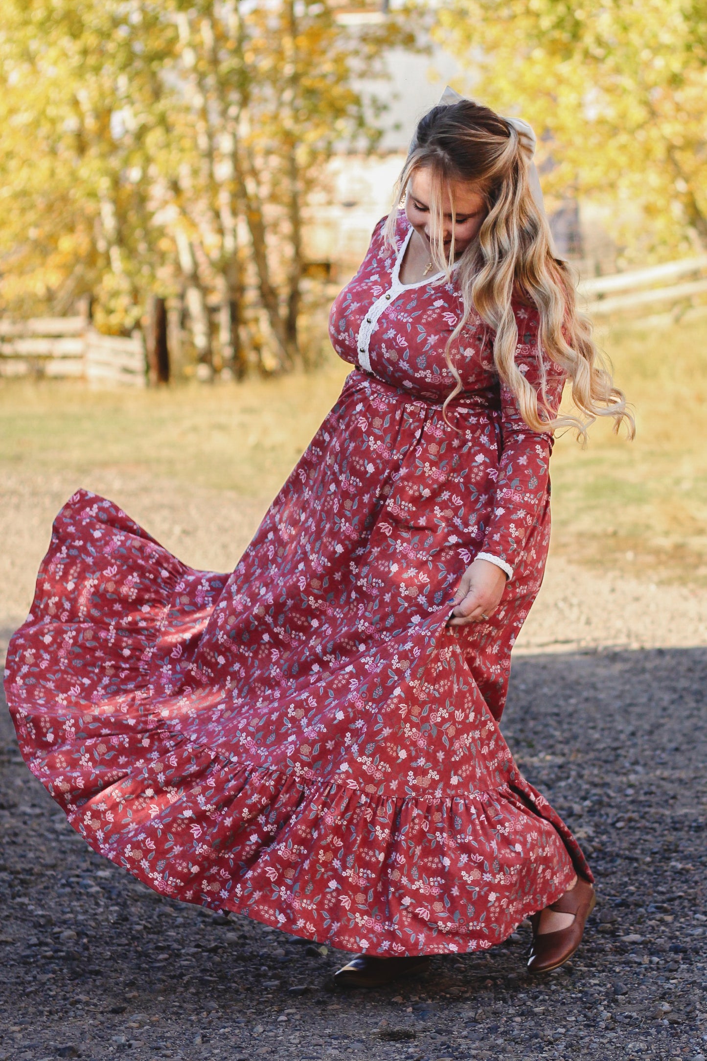 Woman in modest nursing red floral dress outdoors