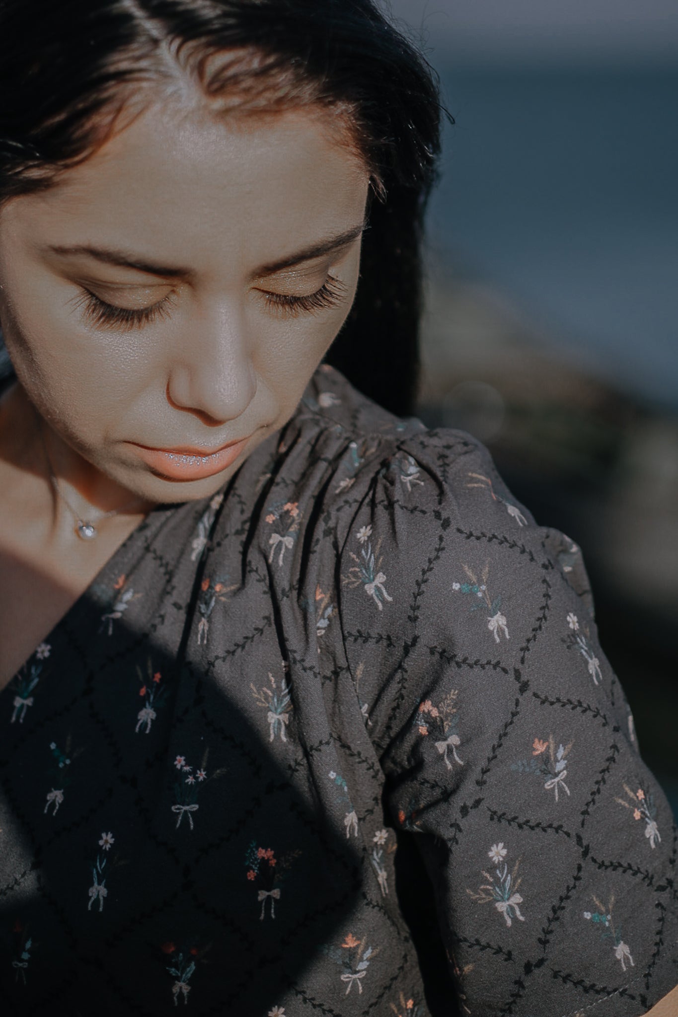 Modest nursing-friendly dark patterned dress closeup