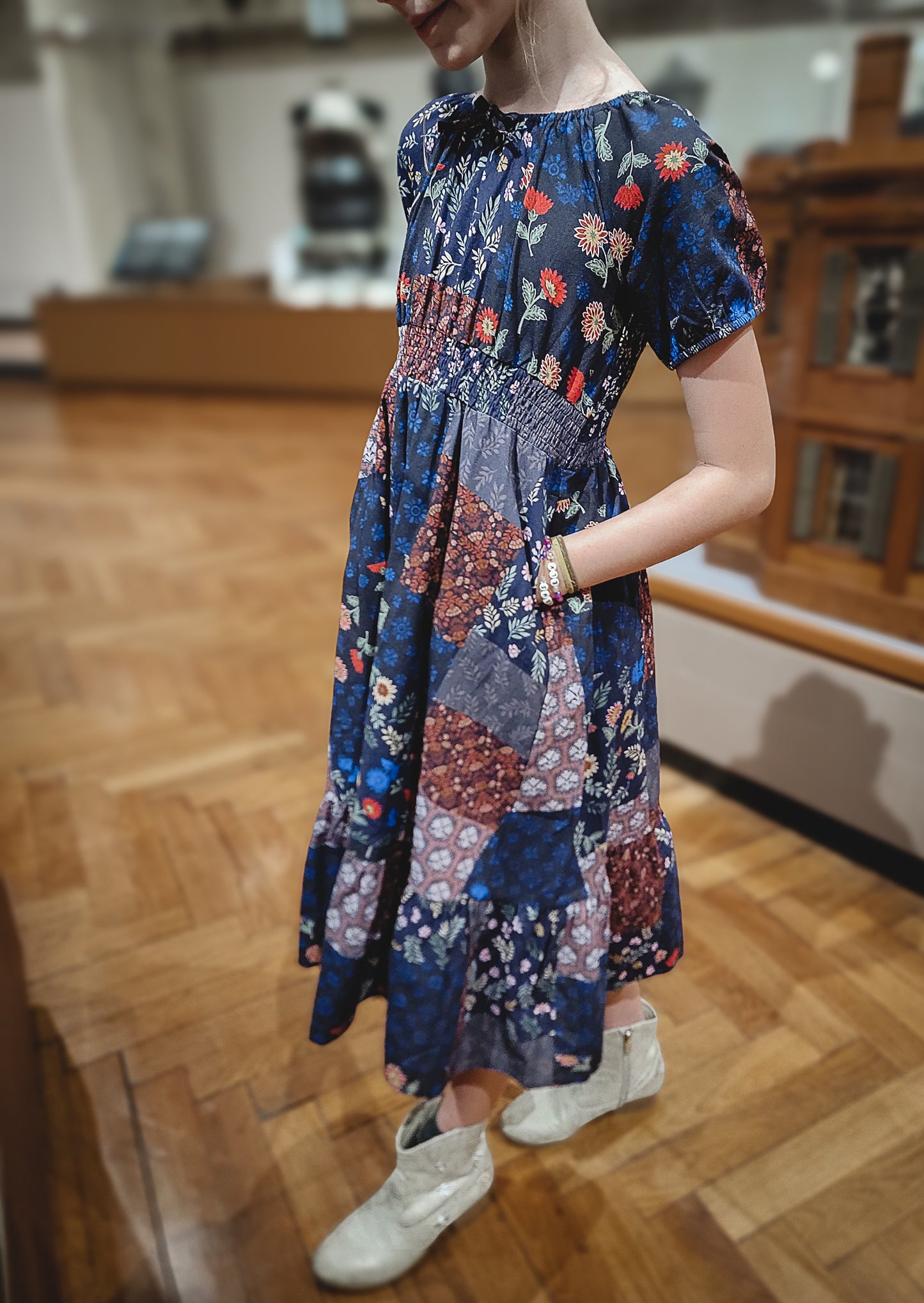 young girl wearing a cute patchwork dress