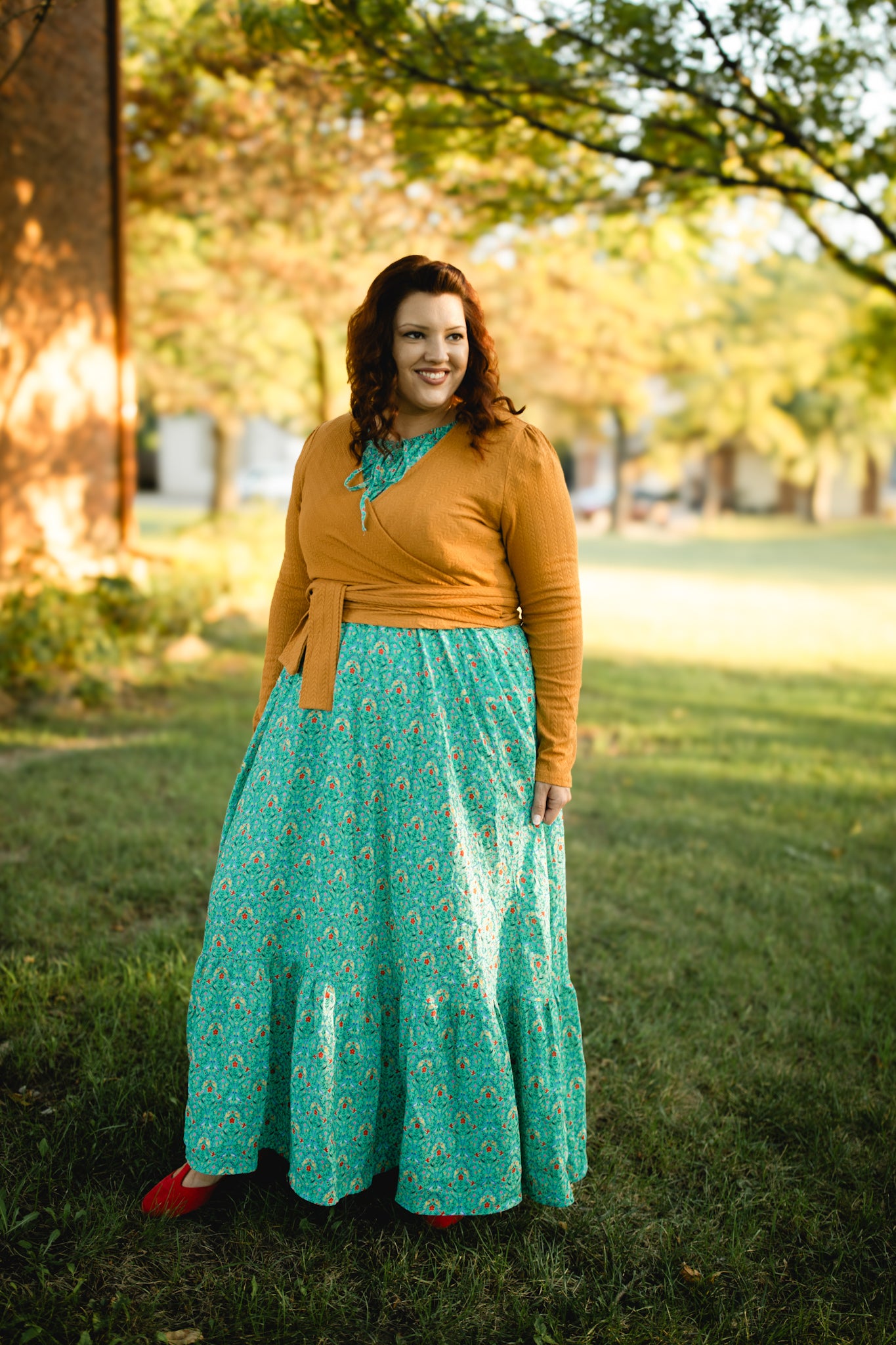 Woman in modest nursing teal skirt outdoors