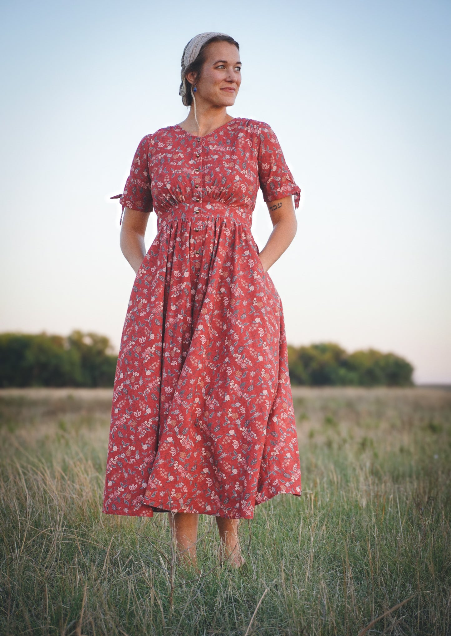 Woman in modest nursing red floral dress outdoors