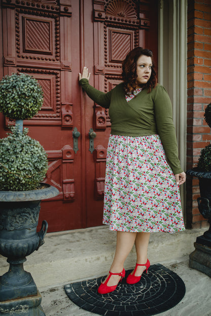 Woman in modest nursing wrap and floral skirt