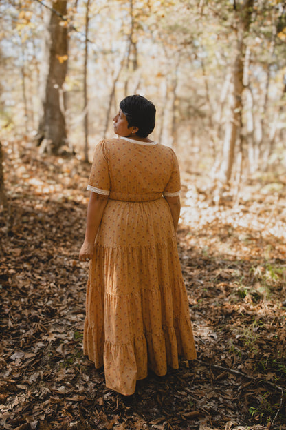 Woman in modest nursing dress standing forest