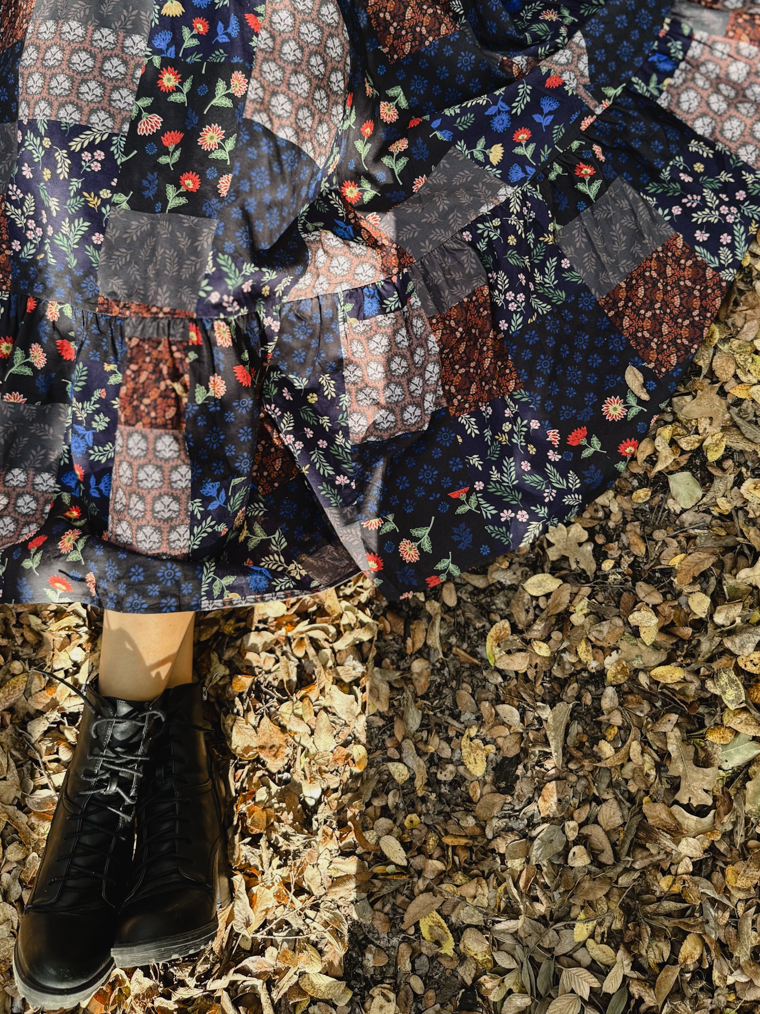 woman wearing a modest nursing patterned dress