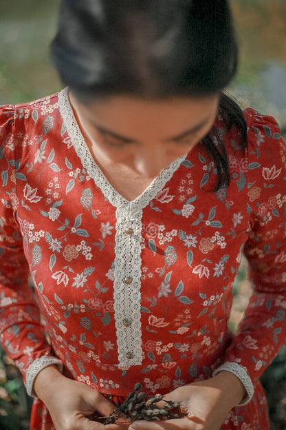 Woman in modest nursing red blouse with lace
