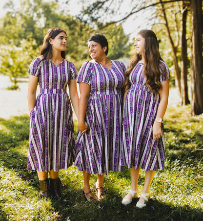women wearing modest nursing purple and white striped dresses