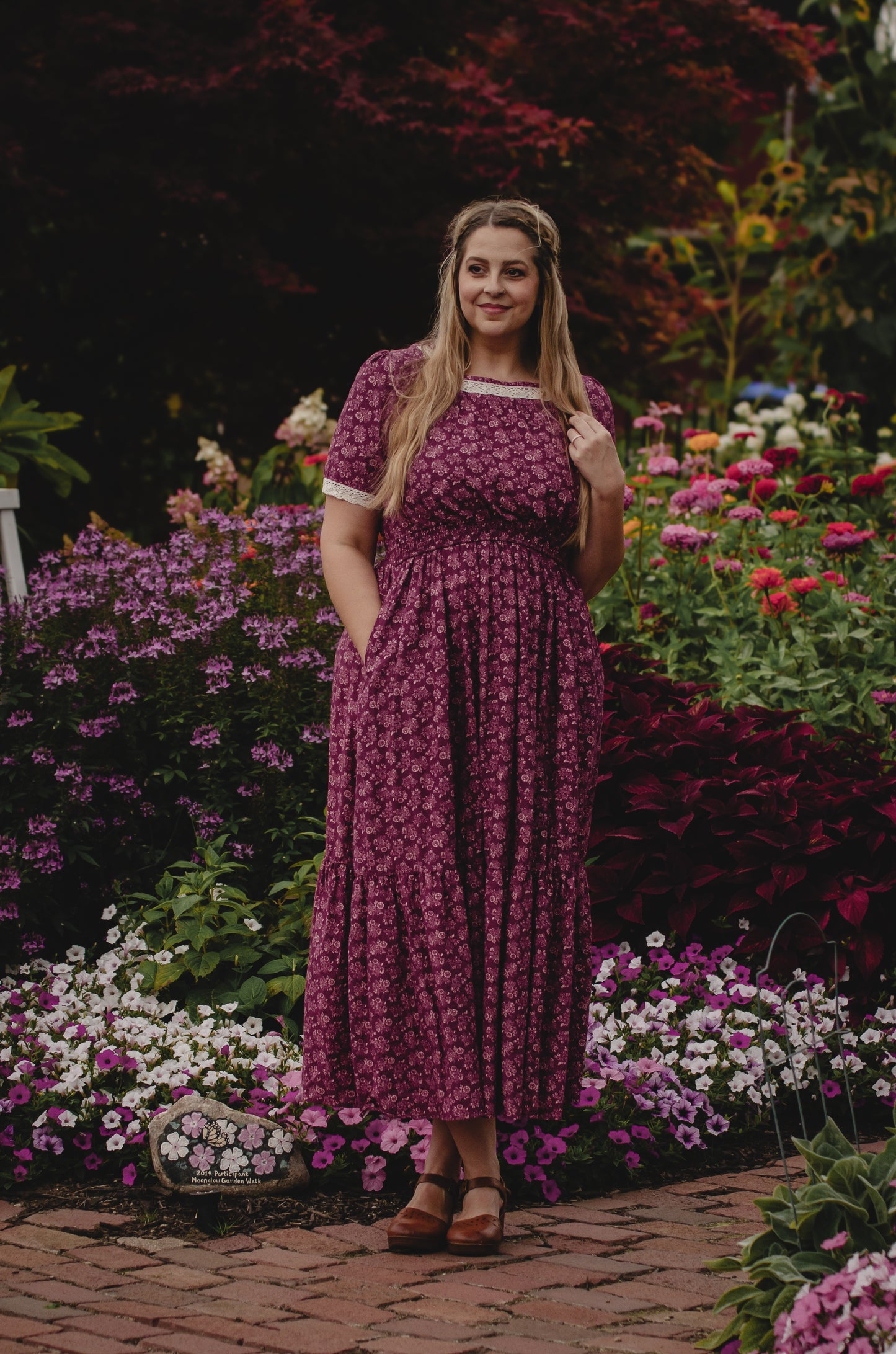 Woman in modest floral nursing dress outdoors