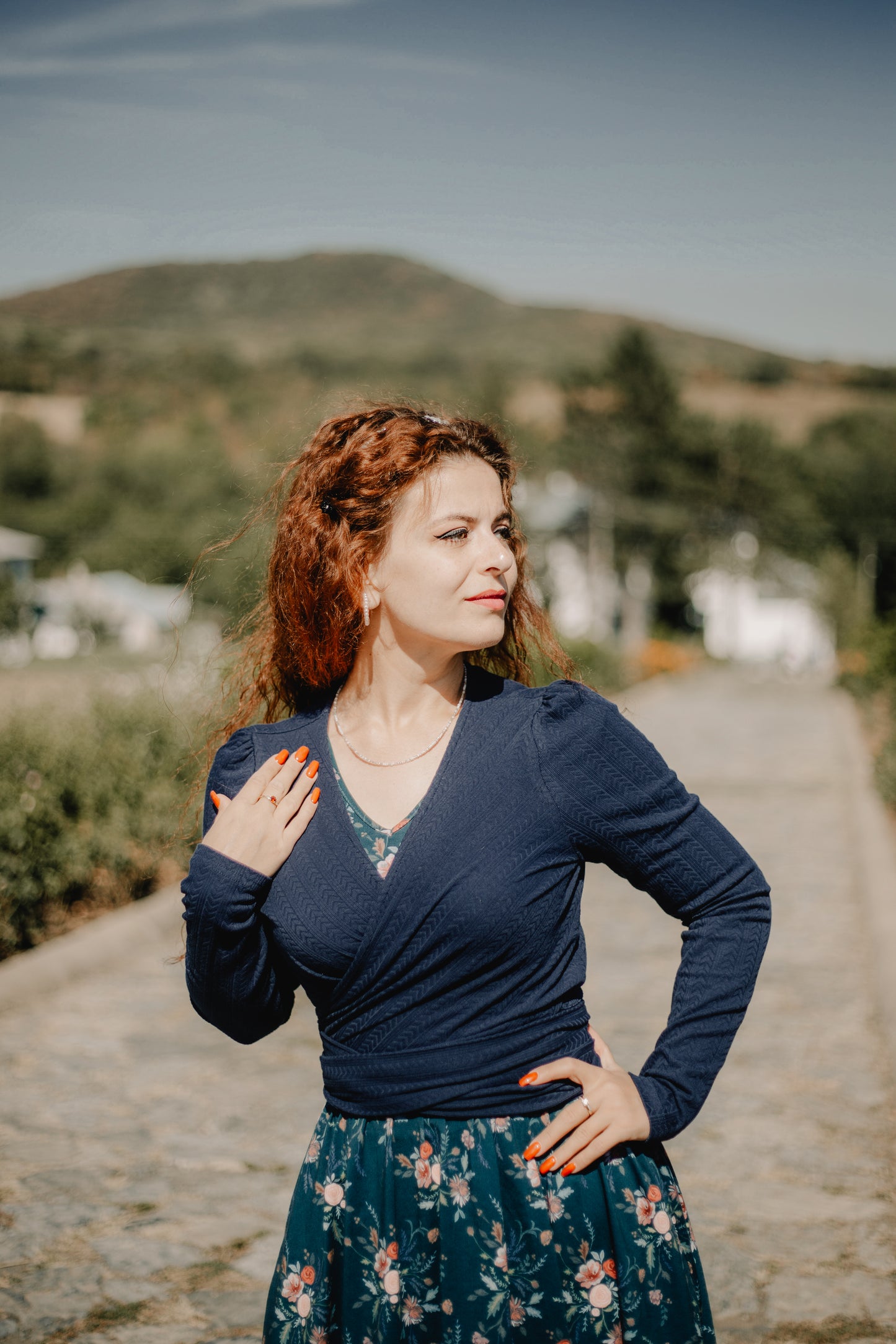 Woman on path with greenery behind
