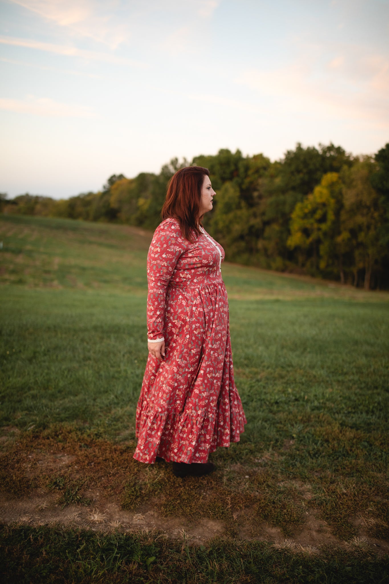 Woman in modest nursing red floral dress outdoors