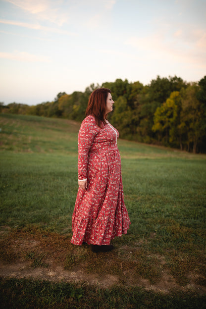 Woman in modest nursing red floral dress outdoors