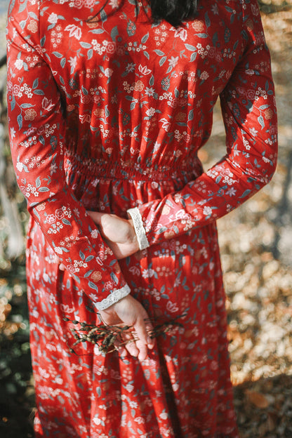 Woman in modest nursing red floral dress outdoors