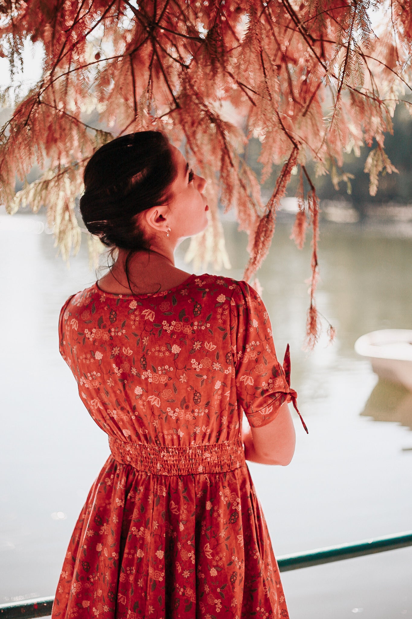 Woman in modest nursing red dress outdoors