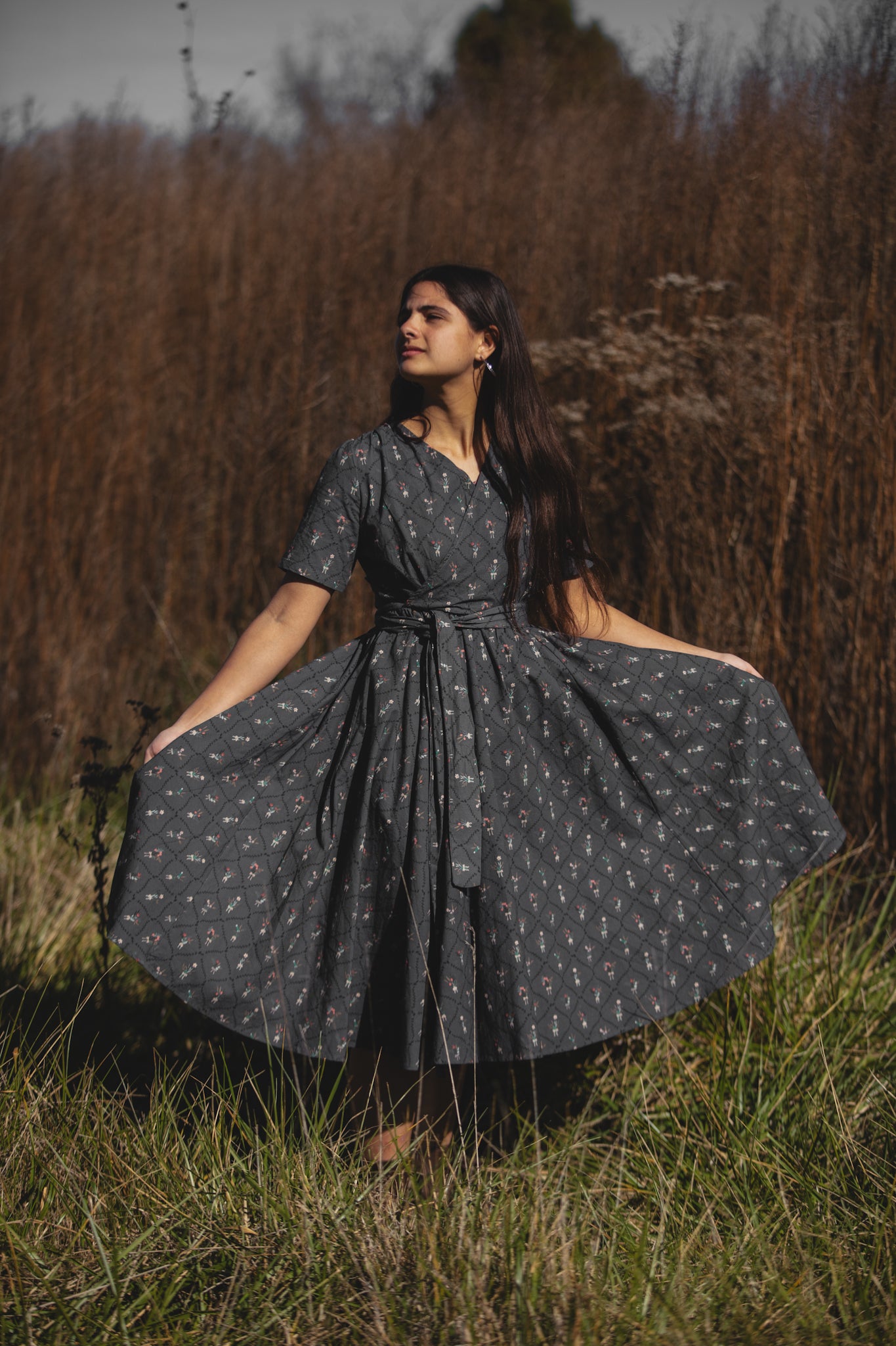 Modest nursing-friendly dark patterned dress in field