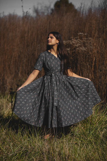 Modest nursing-friendly dark patterned dress in field