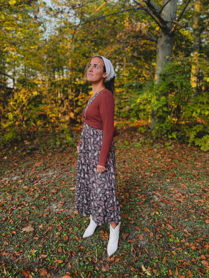 Woman in forest with autumn foliage
