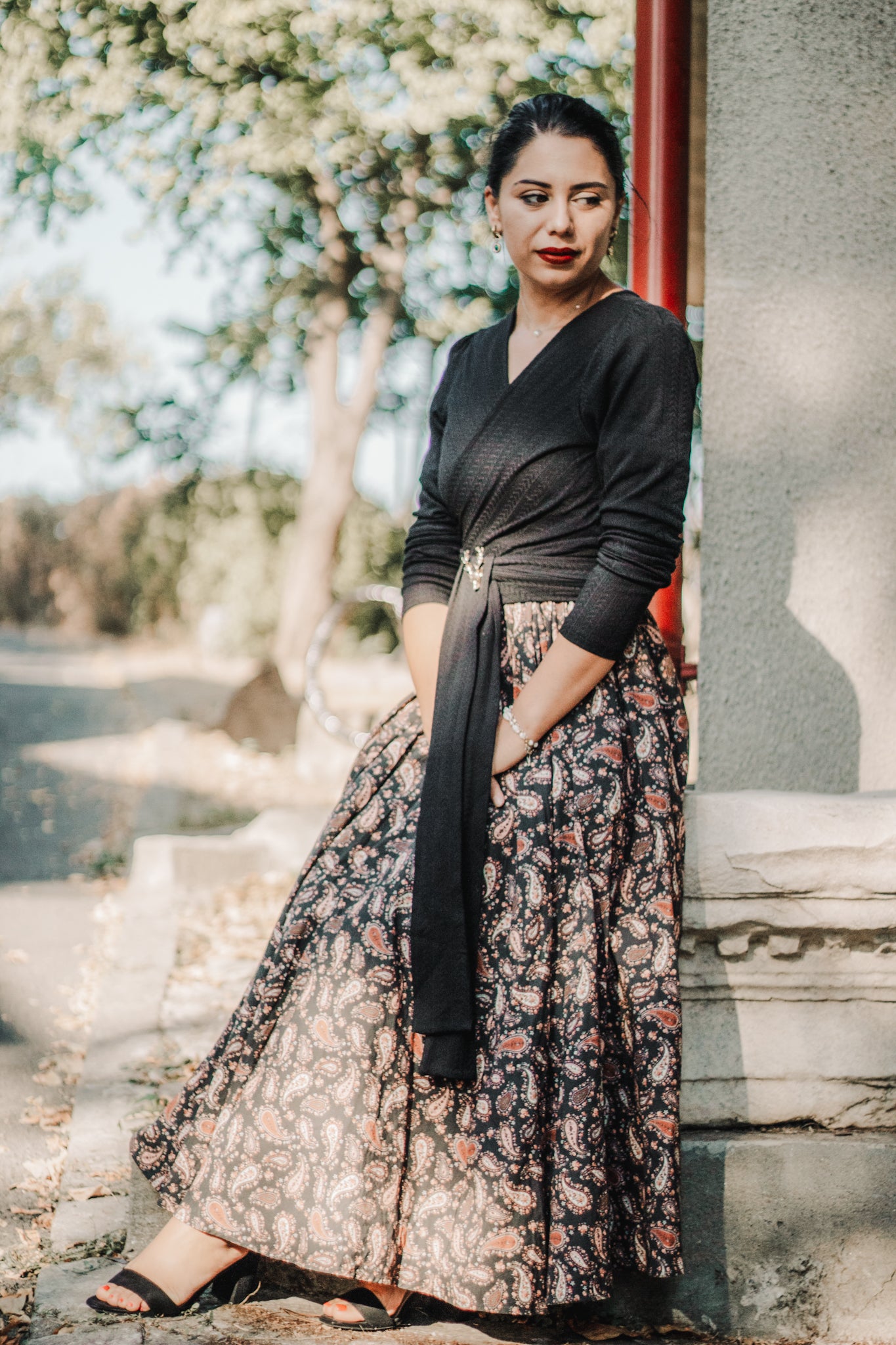 woman wearing a modest nursing black patterned dress