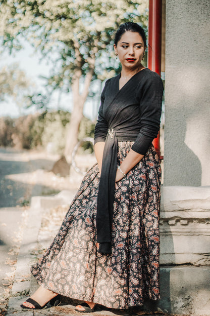 woman wearing a modest nursing black patterned dress