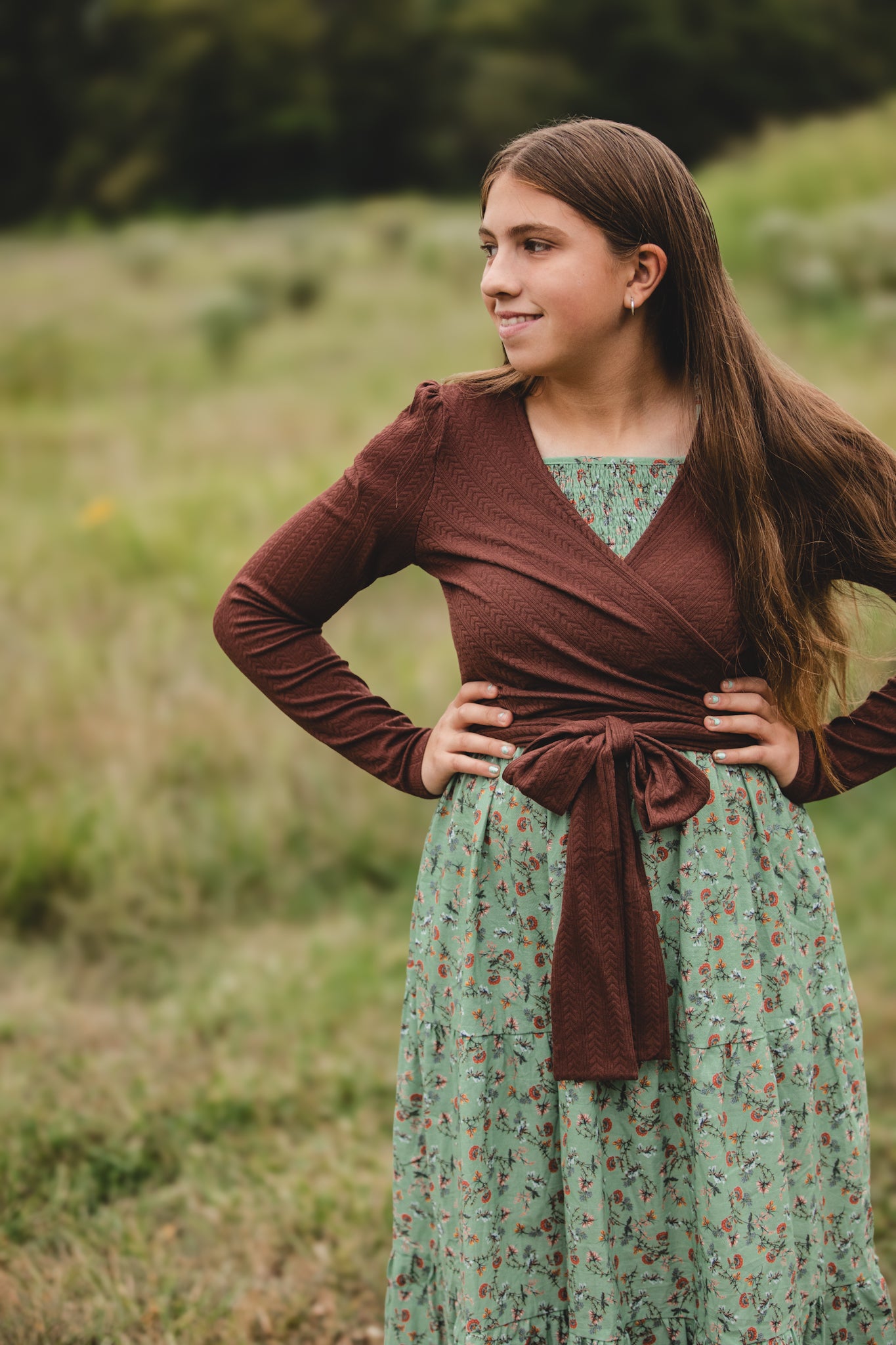 Woman in modest nursing outfit in field