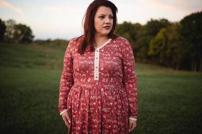 Woman in modest nursing red floral dress outdoors