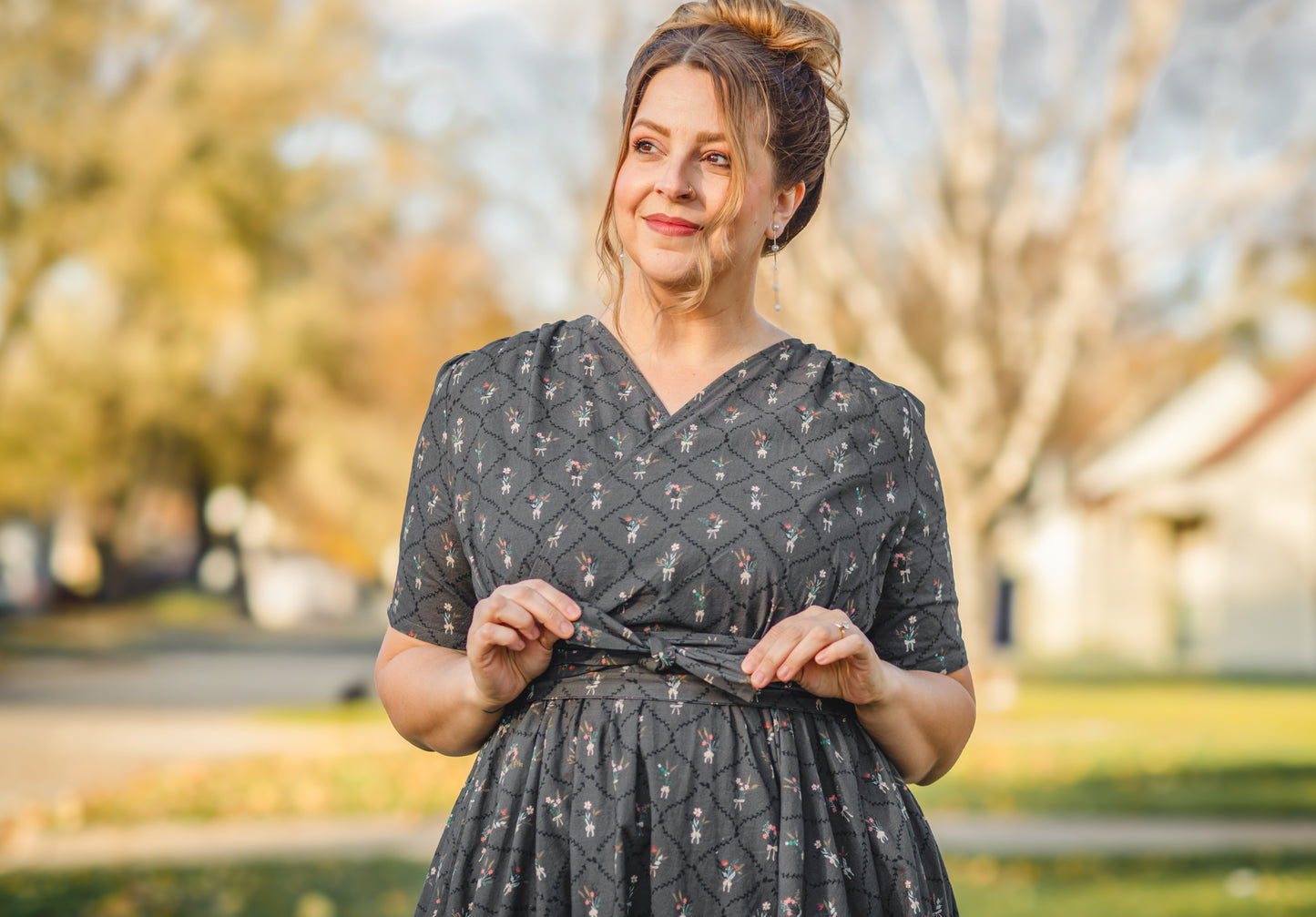 Modest nursing-friendly dark patterned dress outdoors