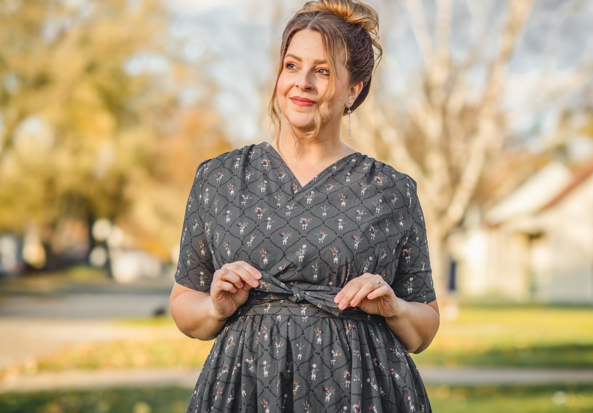 Modest nursing-friendly dark patterned dress outdoors
