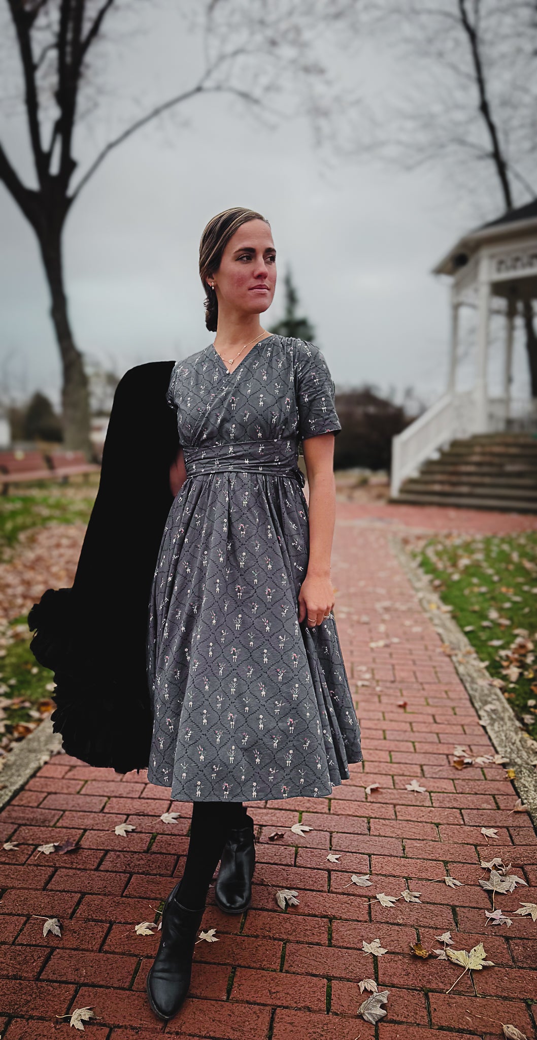 Modest nursing-friendly gray patterned dress on path