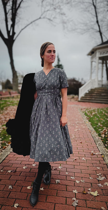 Modest nursing-friendly gray patterned dress on path