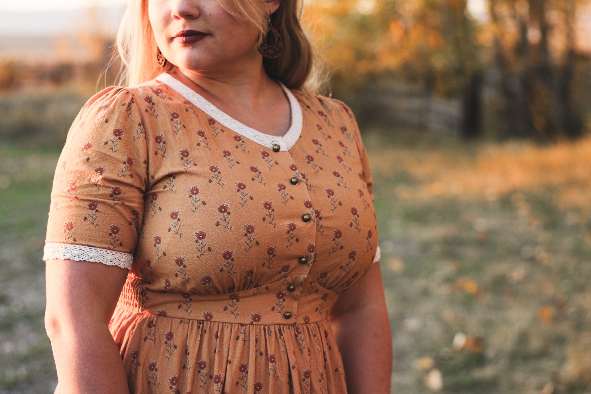 Woman in modest nursing dress outdoor setting