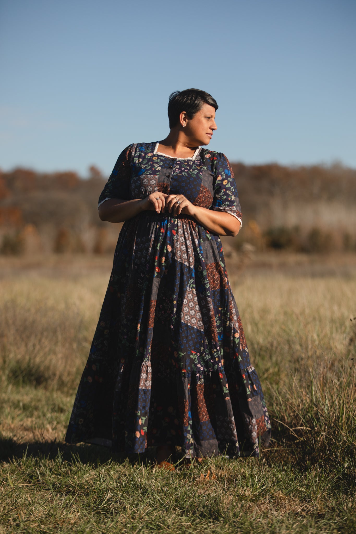 woman wearing a modest nursing patterned dress