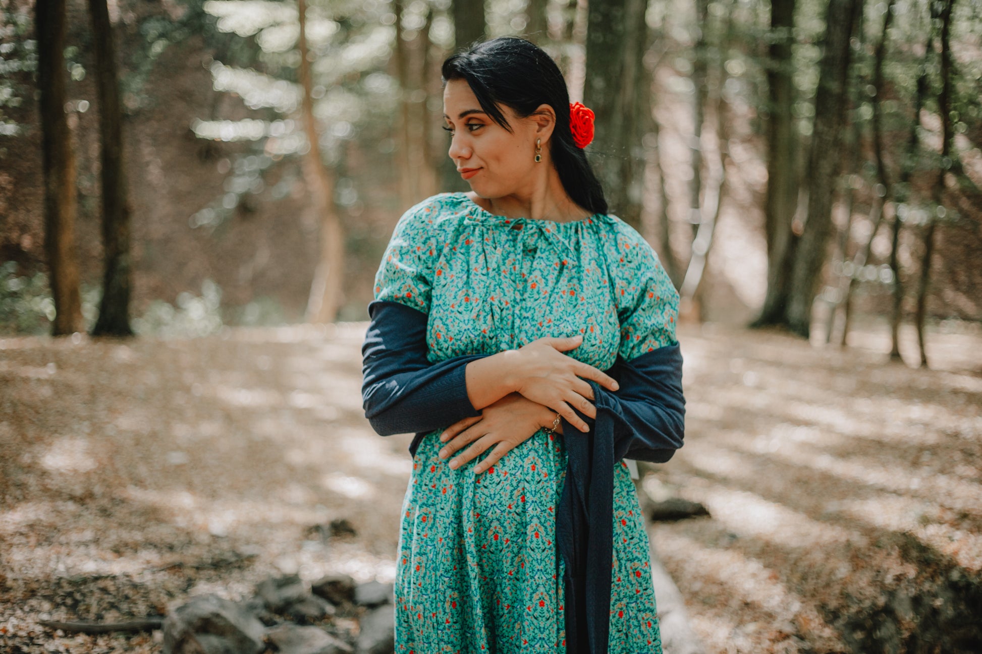 Woman in modest nursing green dress outdoors